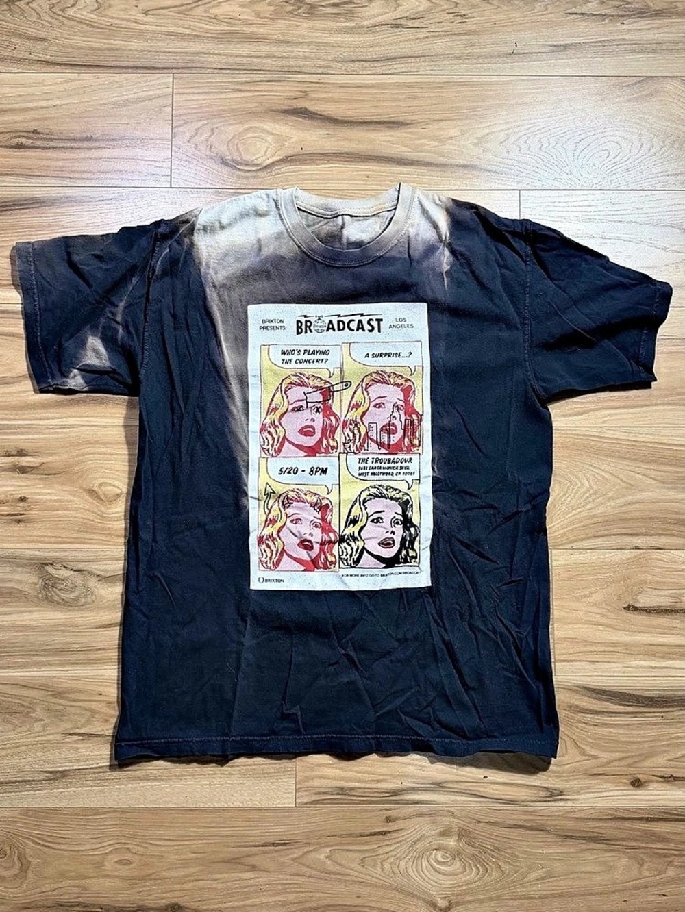 Brixton Broadcast Tee with graphic of four comic-style portraits with text